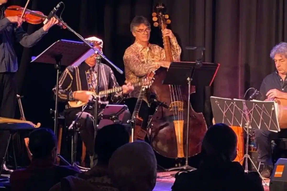 Musicians performing with oud, double bass and violin on stage for Adelaide Baroque