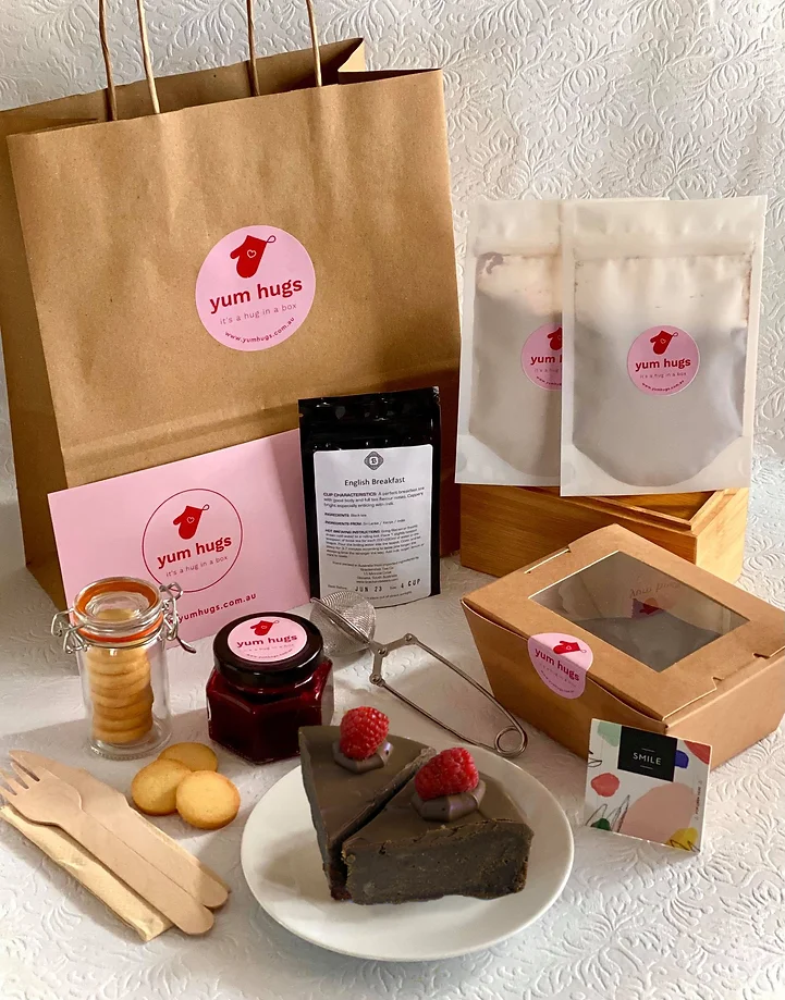 Brown paper bag surrounded by cake and other sweet treats