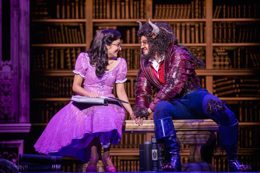 A scene from Beauty and the Beast at the Broadway Theatre, showcasing vibrant costumes and enchanting stage design.