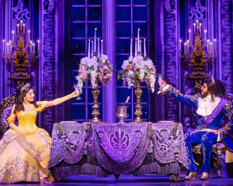 A scene from Beauty and the Beast at the Broadway Theatre, showcasing vibrant costumes and enchanting stage design.