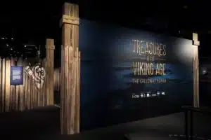 Viking Age treasures displayed, including jewelry, weapons, and artifacts showcasing Norse culture and craftsmanship.