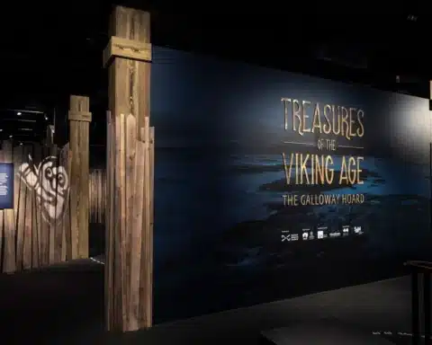 Viking Age treasures displayed, including jewelry, weapons, and artifacts showcasing Norse culture and craftsmanship.