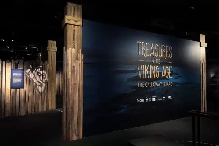 Viking Age treasures displayed, including jewelry, weapons, and artifacts showcasing Norse culture and craftsmanship.