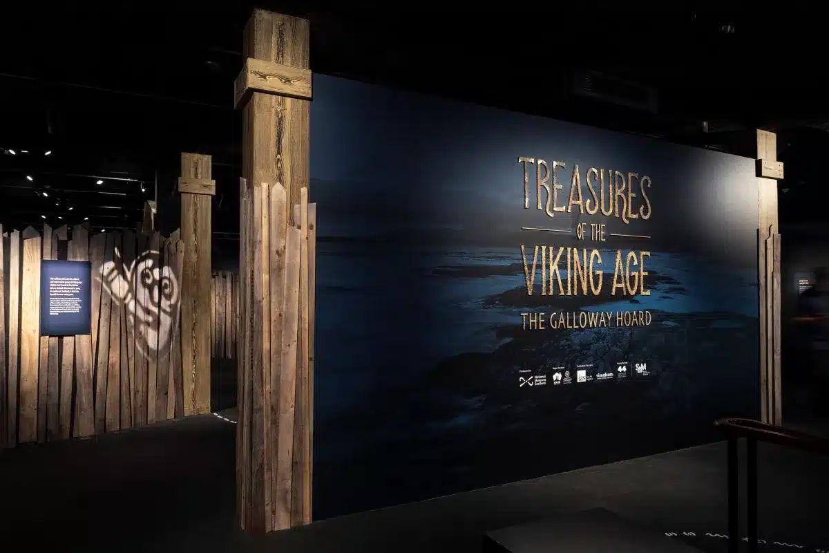 Viking Age treasures displayed, including jewelry, weapons, and artifacts showcasing Norse culture and craftsmanship.
