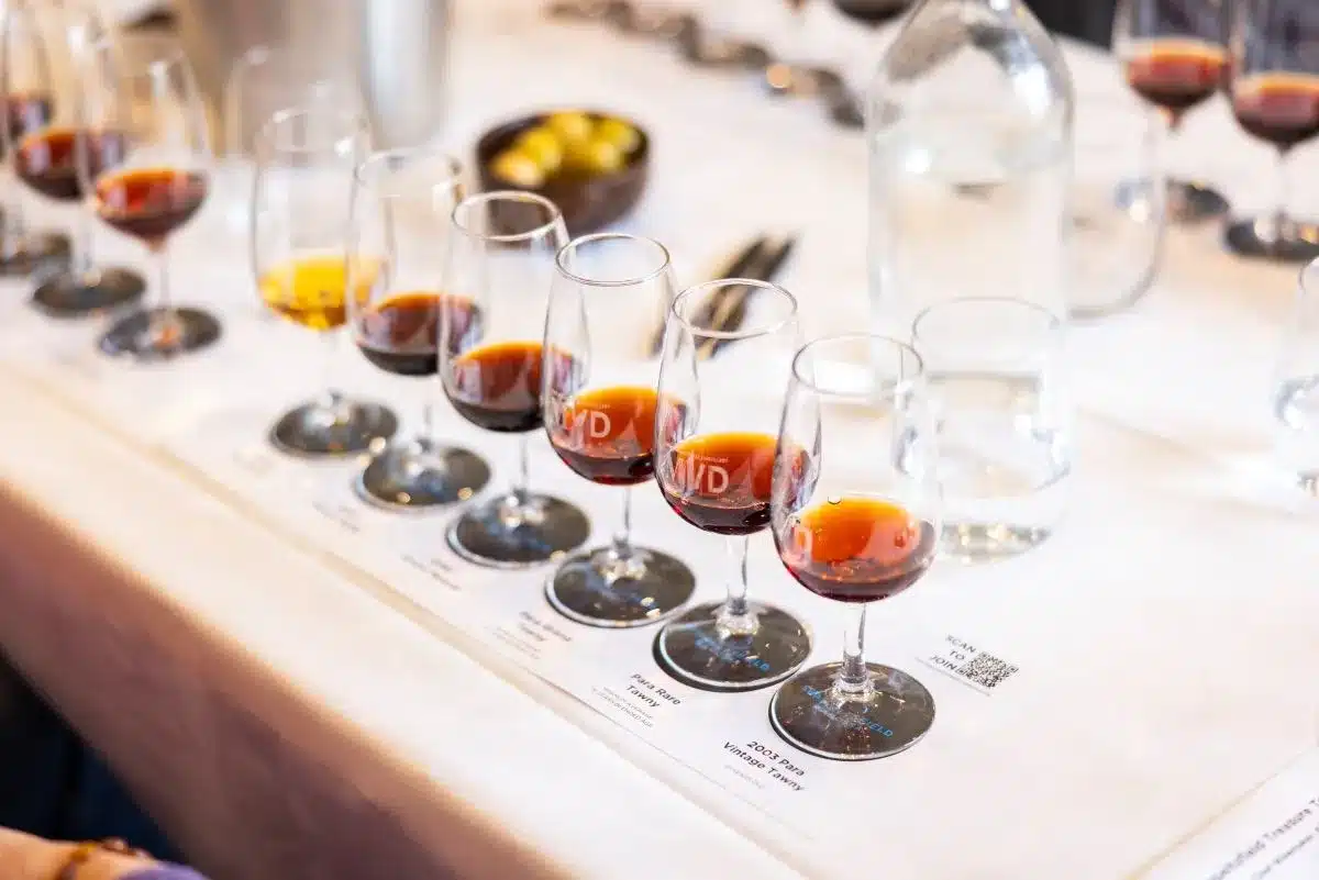Alcoholic beverages lined up on a table.