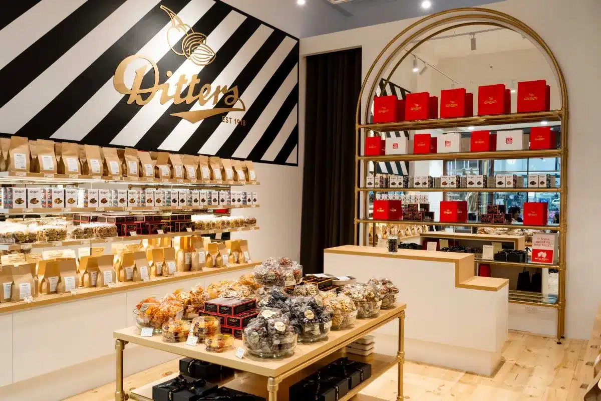 A store interior featuring shelves stocked with a variety of items for sale.