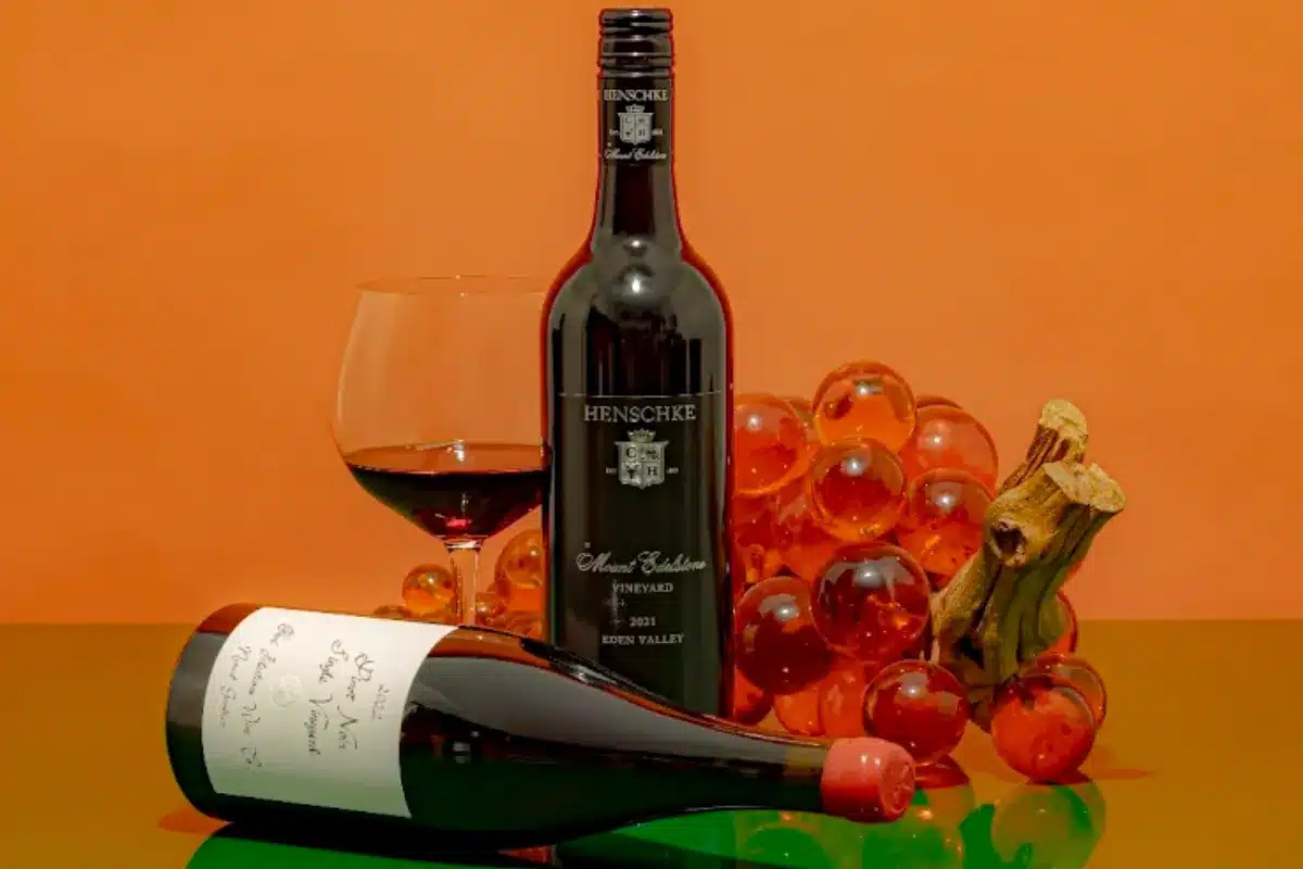 Wine bottles on an orange background.