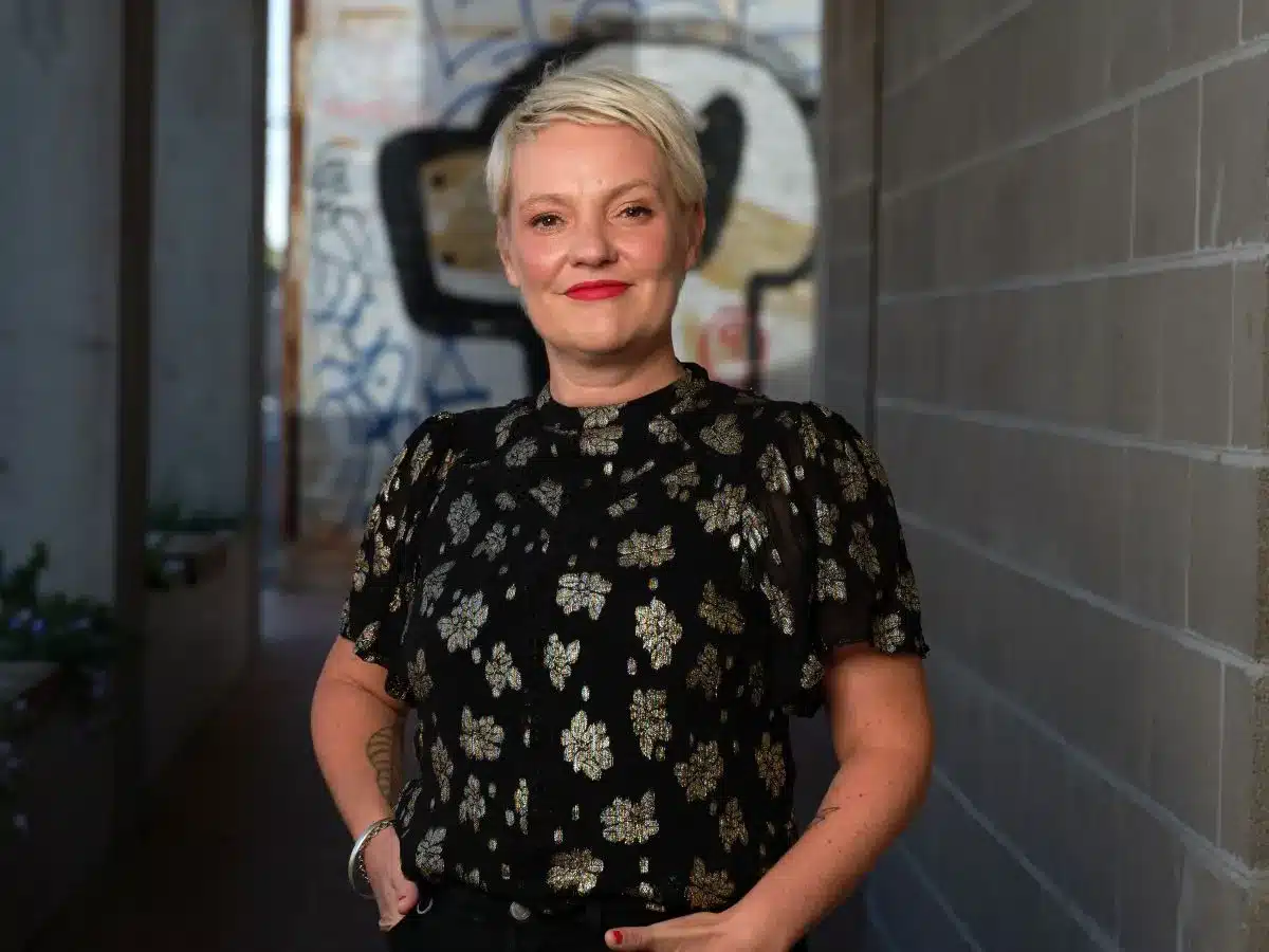 A Wisdom of Age author, Jacinta Parsons, smiles at camera.