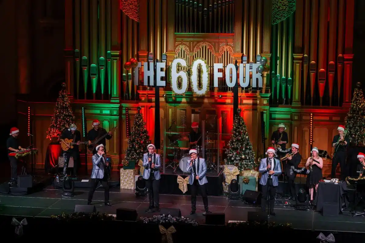 The 60 Four band performs on stage.