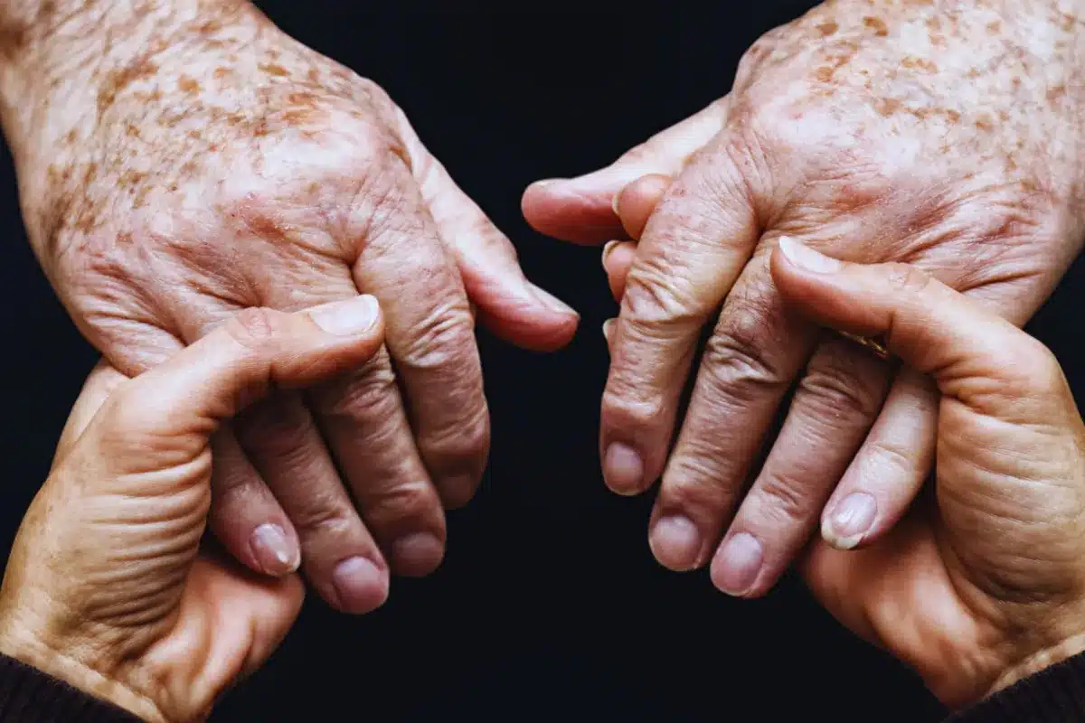 Person holding older hands.
