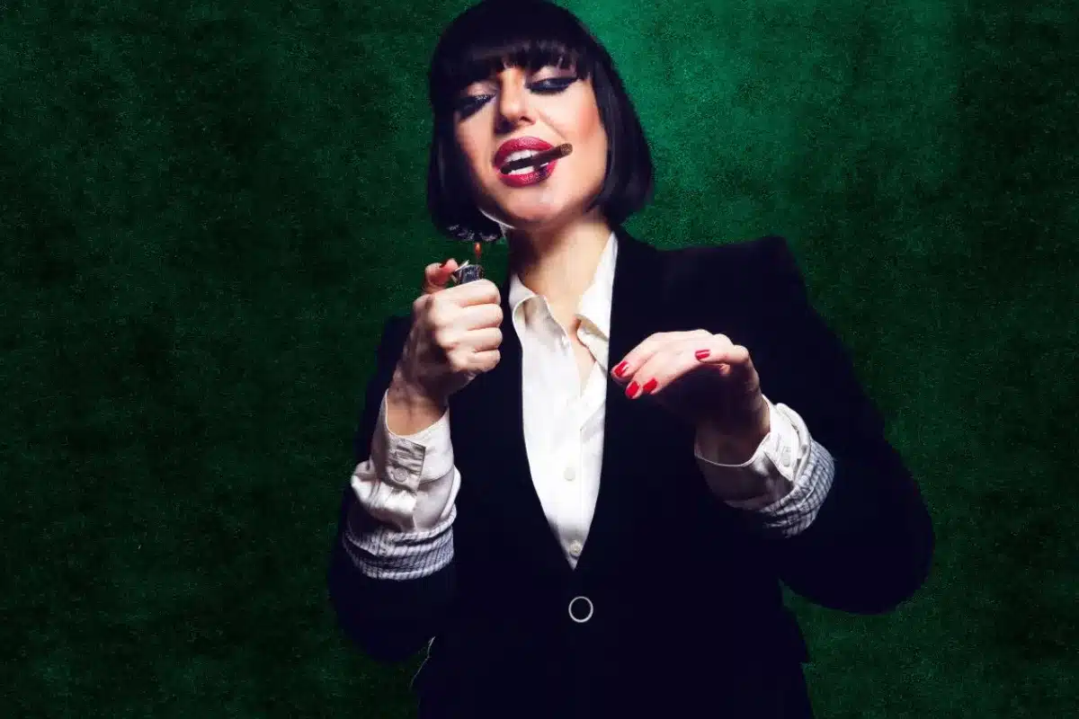 A woman in a suit and tie .