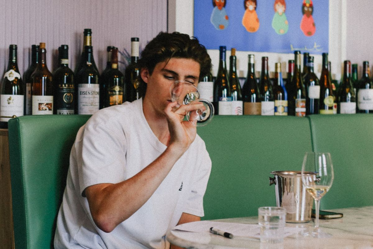 A man sits in a restaurant sampling a selection of wines in South Australia.