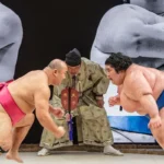 two sumo wrestlers face off in a match