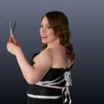 Poster for Adelaide Fringe 2026 show Skinny. A woman in a dress holding red scissors.