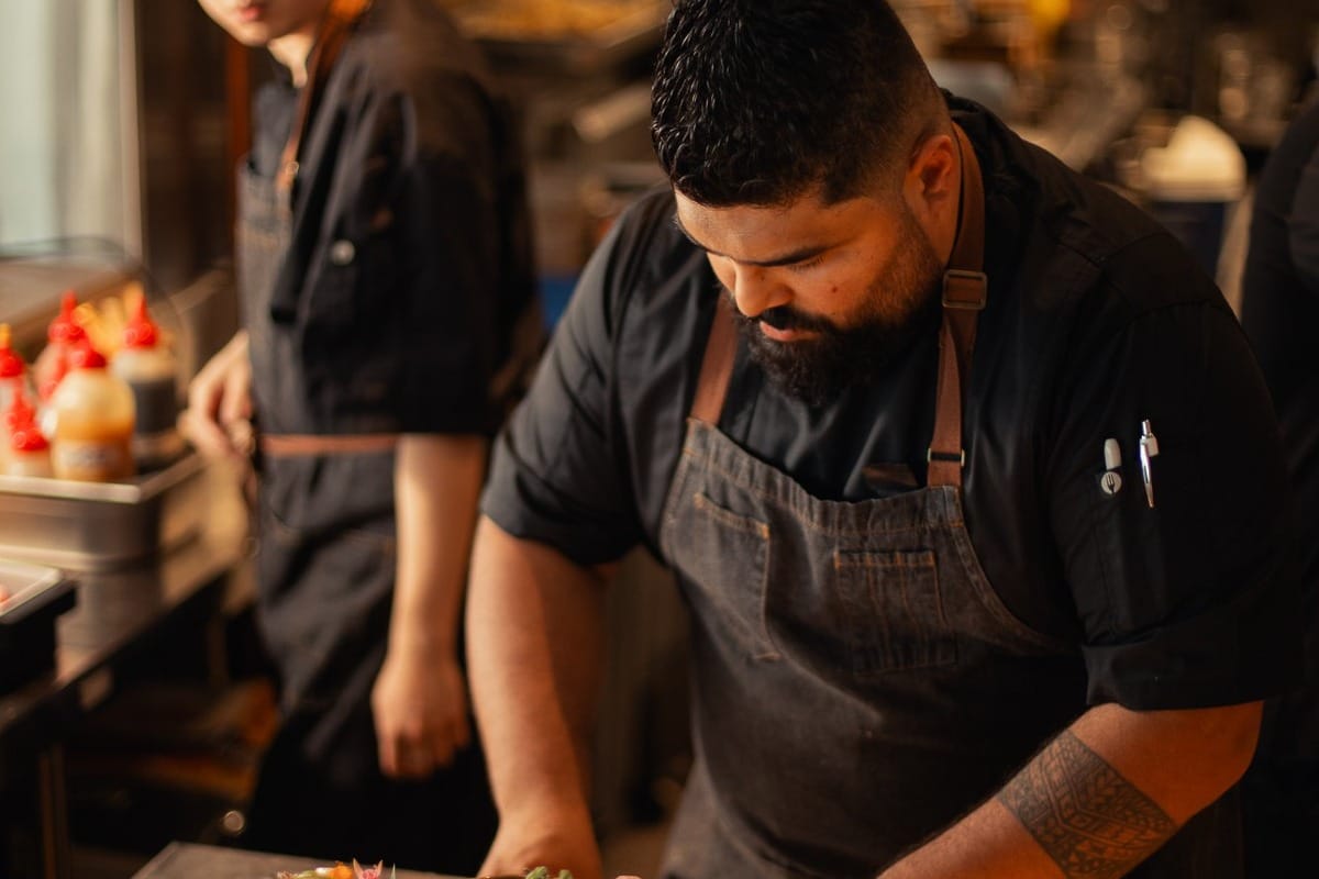 Tunki Ceviche & Woodfire Grill restaurant, Adelaide Head Chef Krish Dutt preparing a South Australian fish dish.