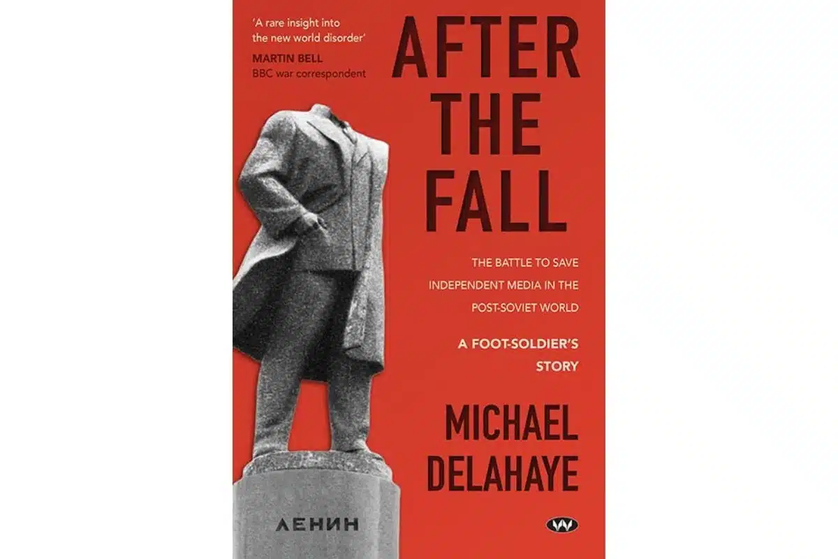 Book cover of After the Fall by Michael Delahaye, featuring a headless Lenin statue on a red background