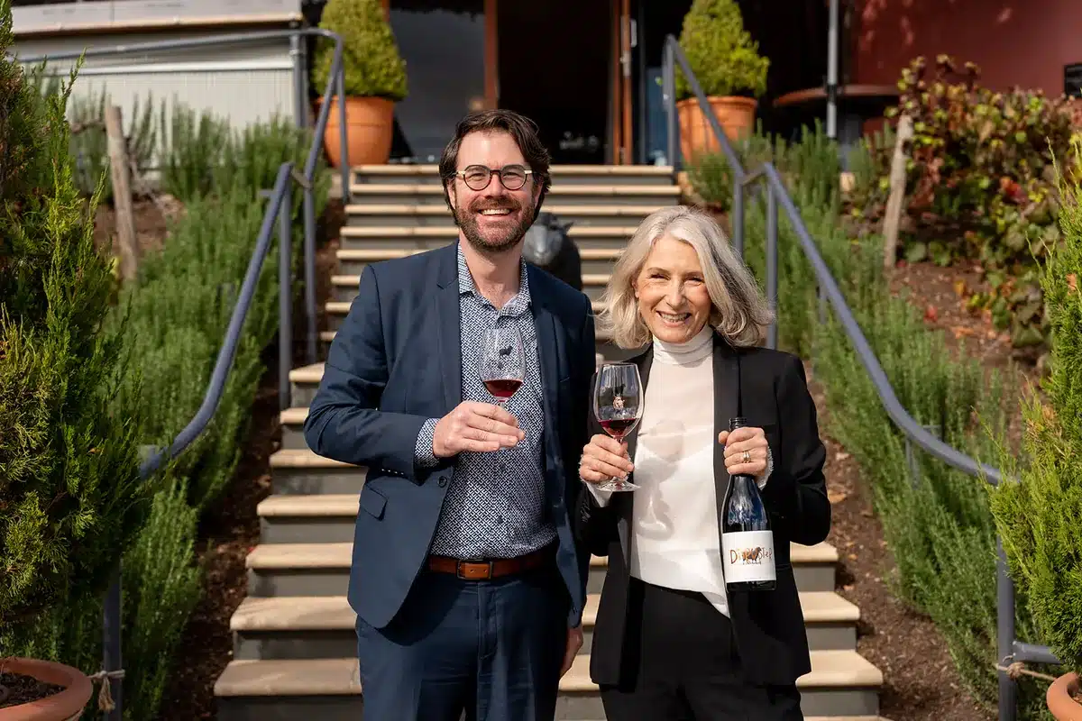 Dane Wilden and guest holding wine at a South Australia’s History Festival event