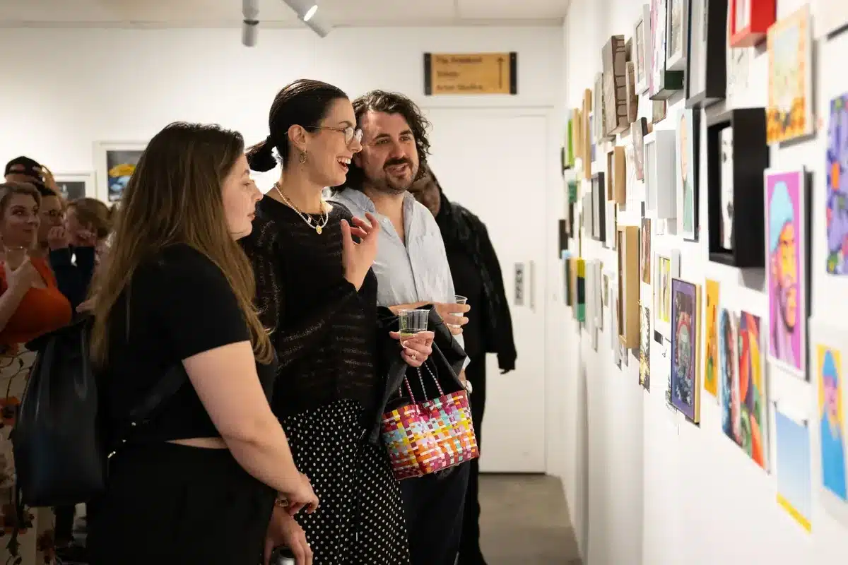 The Mill Creative Studio, Adelaide. A group of people attending an art exhibition admiring the installation.