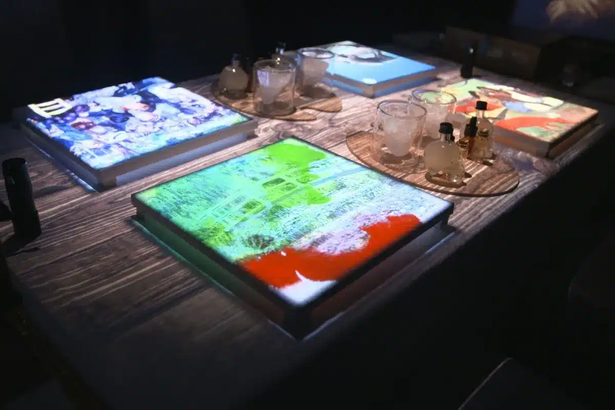 7 Paintings Dining Experience, Adelaide. Image projections on dining table.