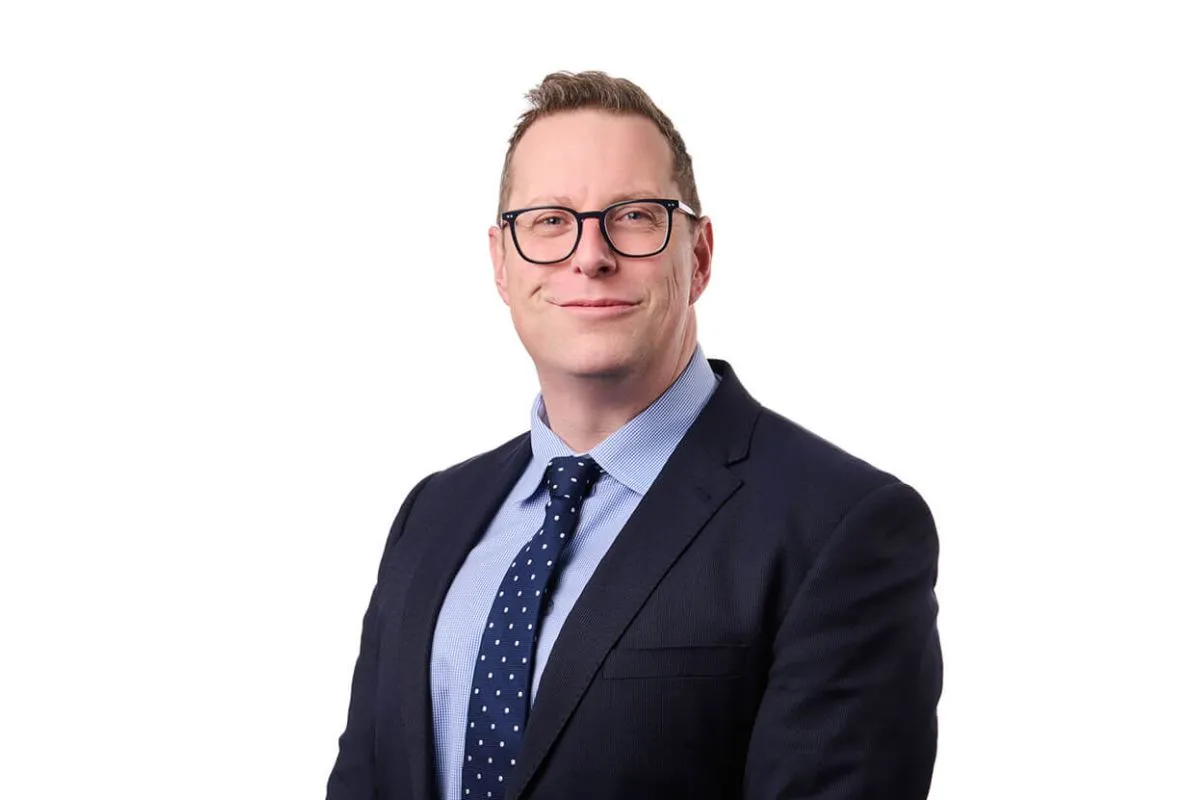 Portrait of DBH Lawyers Partner, Matthew Arentz wearing a suit and tie.