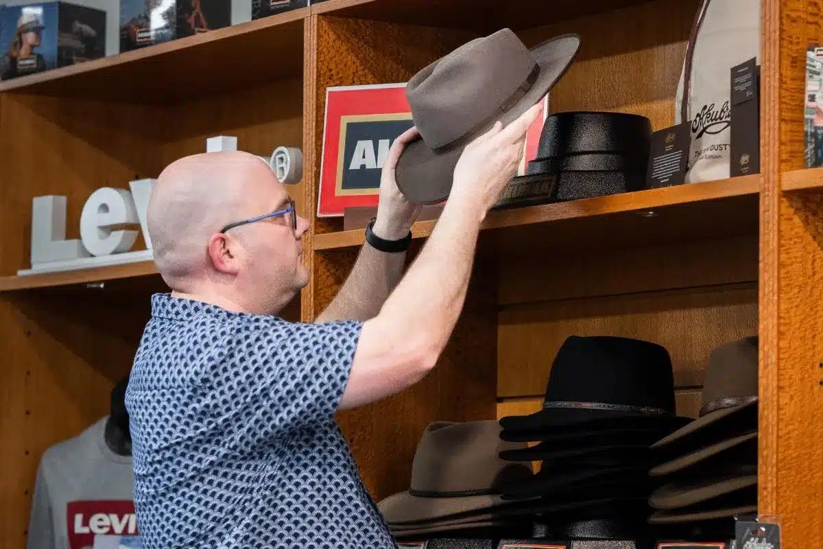 A man browses a selection of clothing inside Mr Menswear, Victor Harbor's menswear store celebrating 41 years in business.