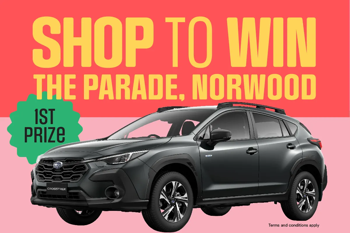 Norwood Parade, Adelaide, shop to win promotion featuring a black car and colourful banner.