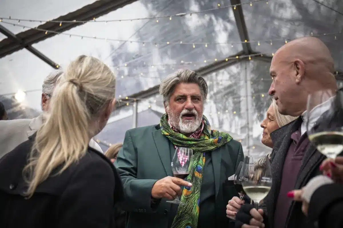 Matt Preston holding a glass of red wine at the 2025 Winter Reds Festival in the Adelaide Hills. Photo credit: Eat Media.