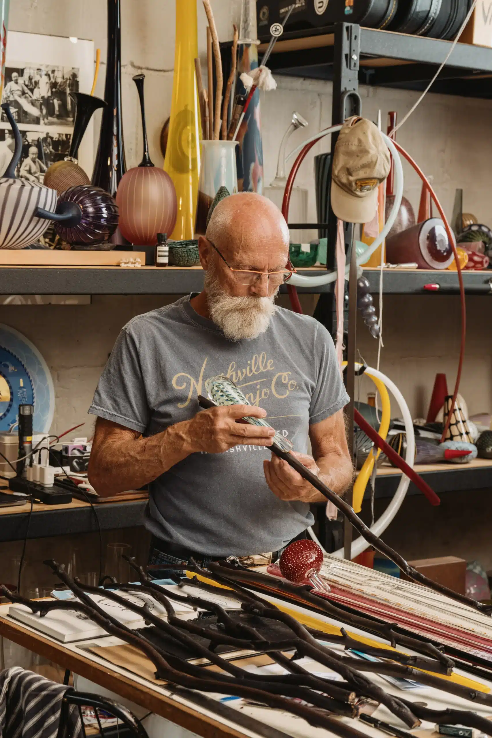 Glass artist Nick Mount in his studio surrounded by glassworks, preparing his contribution to the Making Old New exhibition at David Roche Gallery. Photo credit: Connor Patterson Photography.
