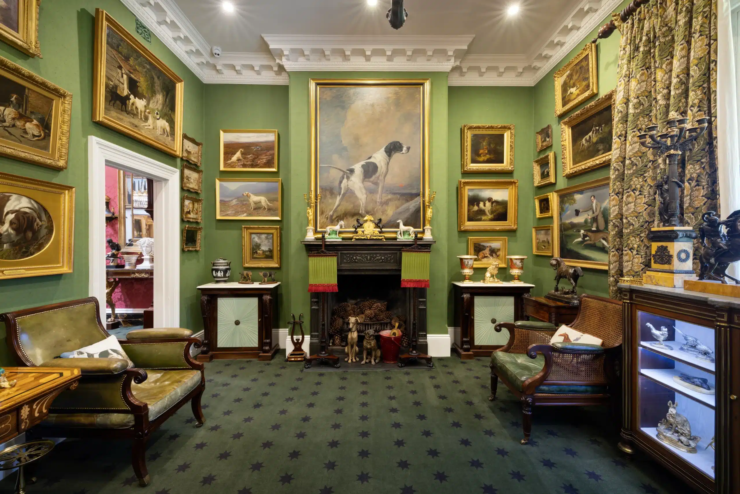 The Den at Fermoy House, David Roche Gallery, featuring a collection of animal paintings and decorative arts.