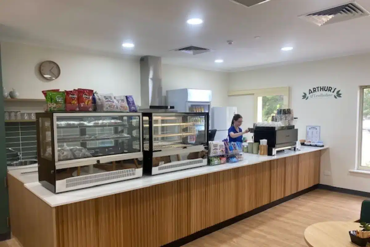A staff member at the counter of Arthur's Café at Lealholme Residential Care Home in Port Pirie.