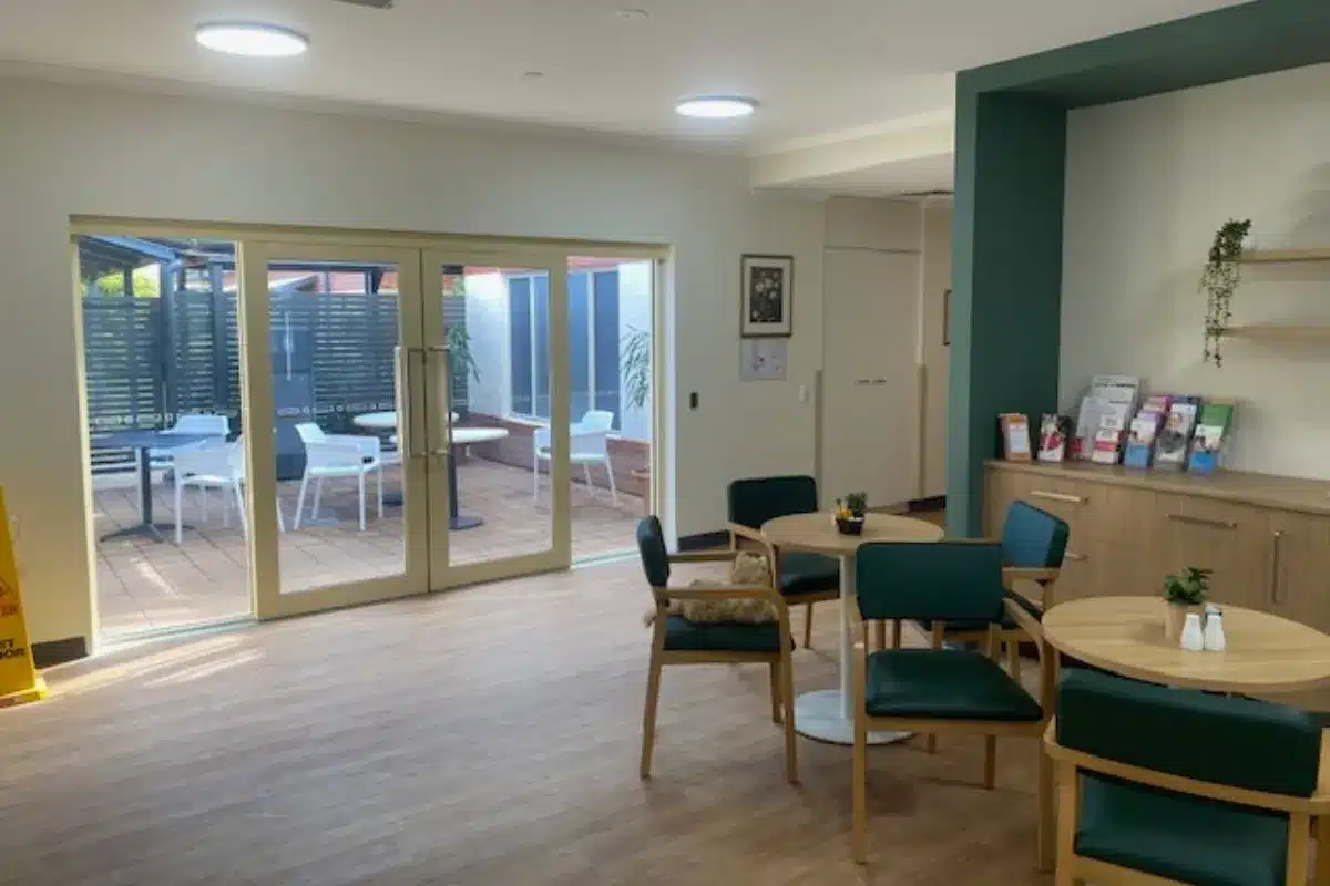 The indoor seating area and outdoor courtyard at Arthur's Café at Lealholme Residential Care Home in Port Pirie.