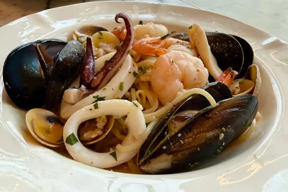 A plate of seafood linguini.