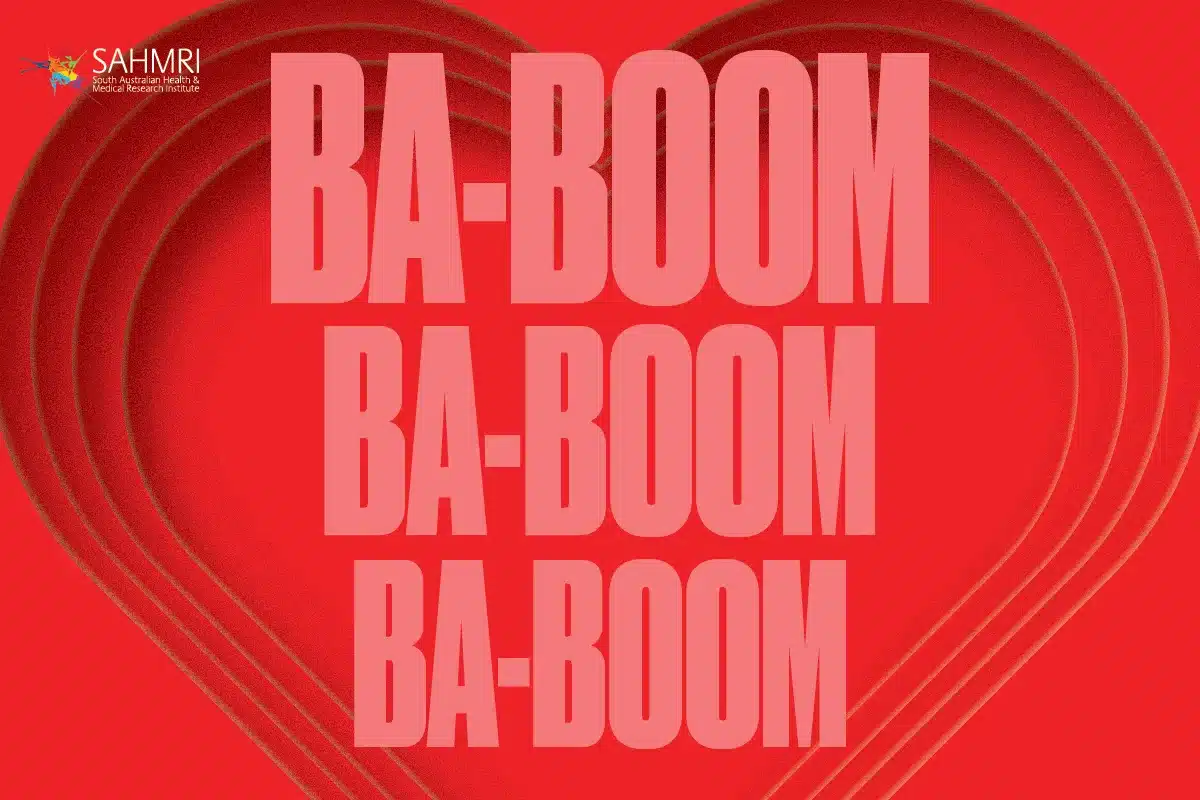 SAHMRI campaign graphic featuring the words "Ba-boom ba-boom ba-boom" over a layered paper heart on a red background