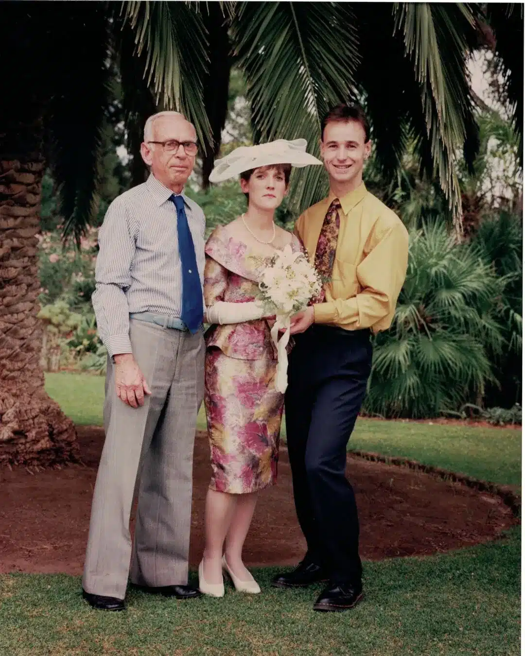 A family portrait of Tracy Crisp with her beloved grandfather taken outside under the canopy of a large tree.
