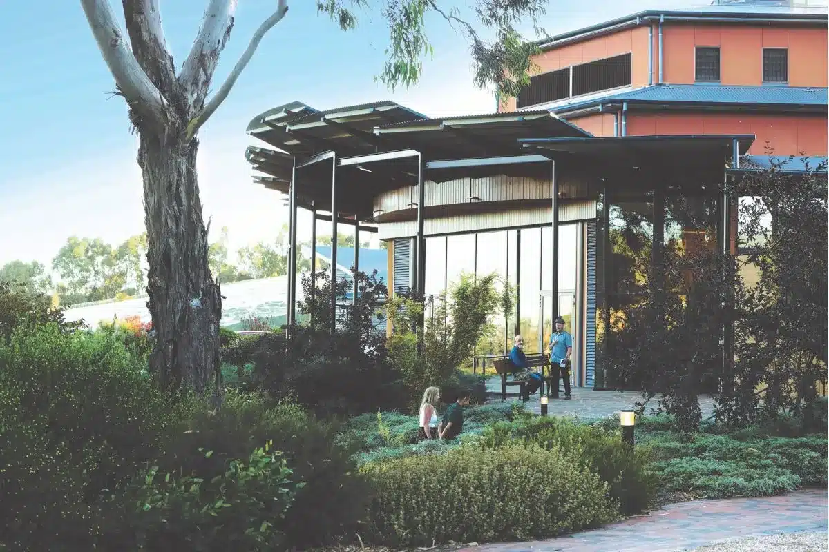 Guests relaxing in the garden surrounds of UKARIA Cultural Centre in the Adelaide Hills