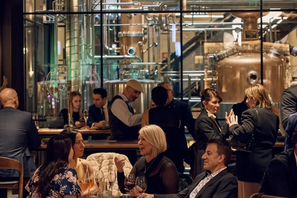 Guests socialising in front of the distillery at COLAC, Port Adelaide