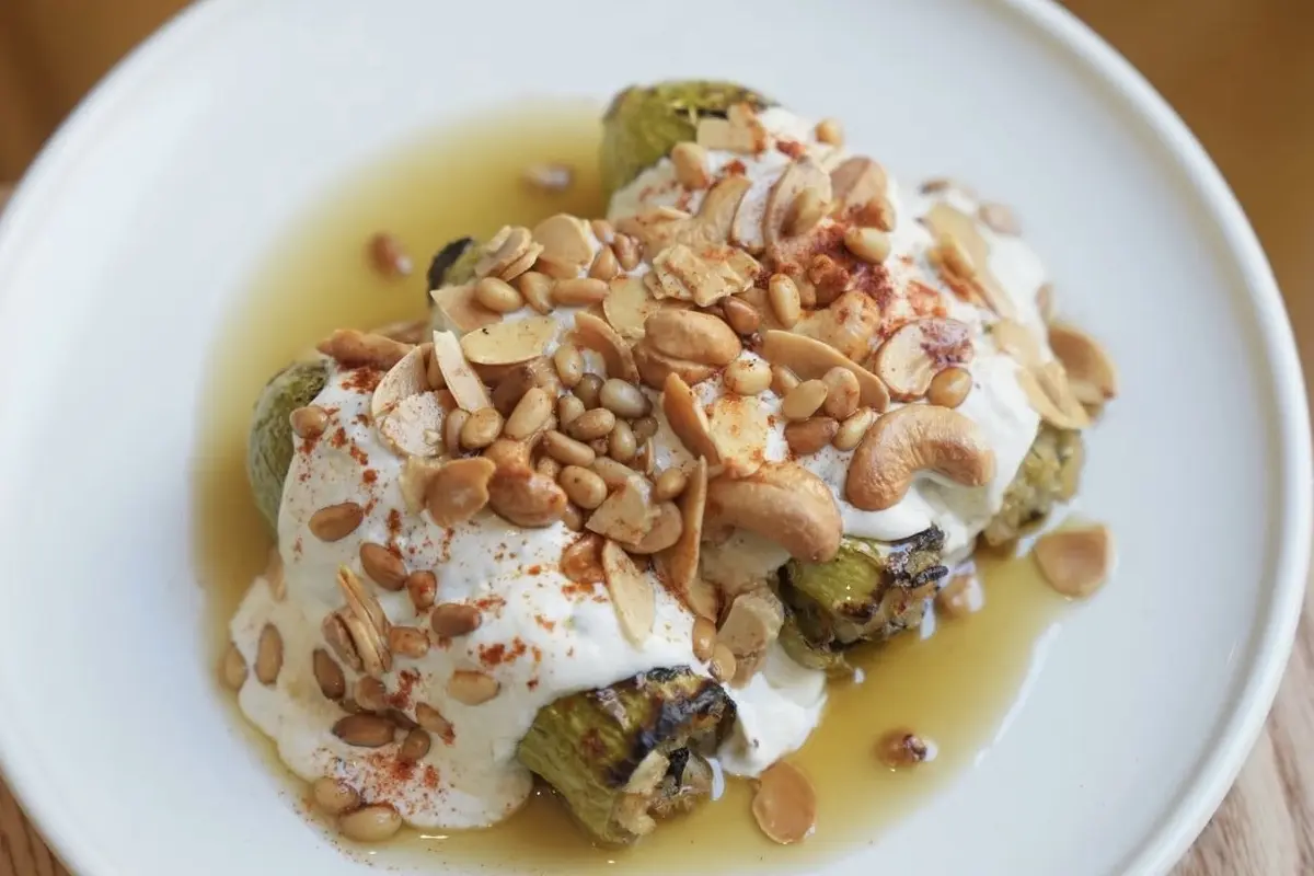 A roasted vegetable dish with yoghurt and mixed nuts at Omada Bar & Grill, Adelaide
