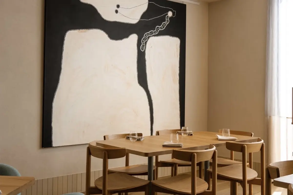 The elegant dining table with feature wall art at Station Road restaurant, Festival Plaza Adelaide