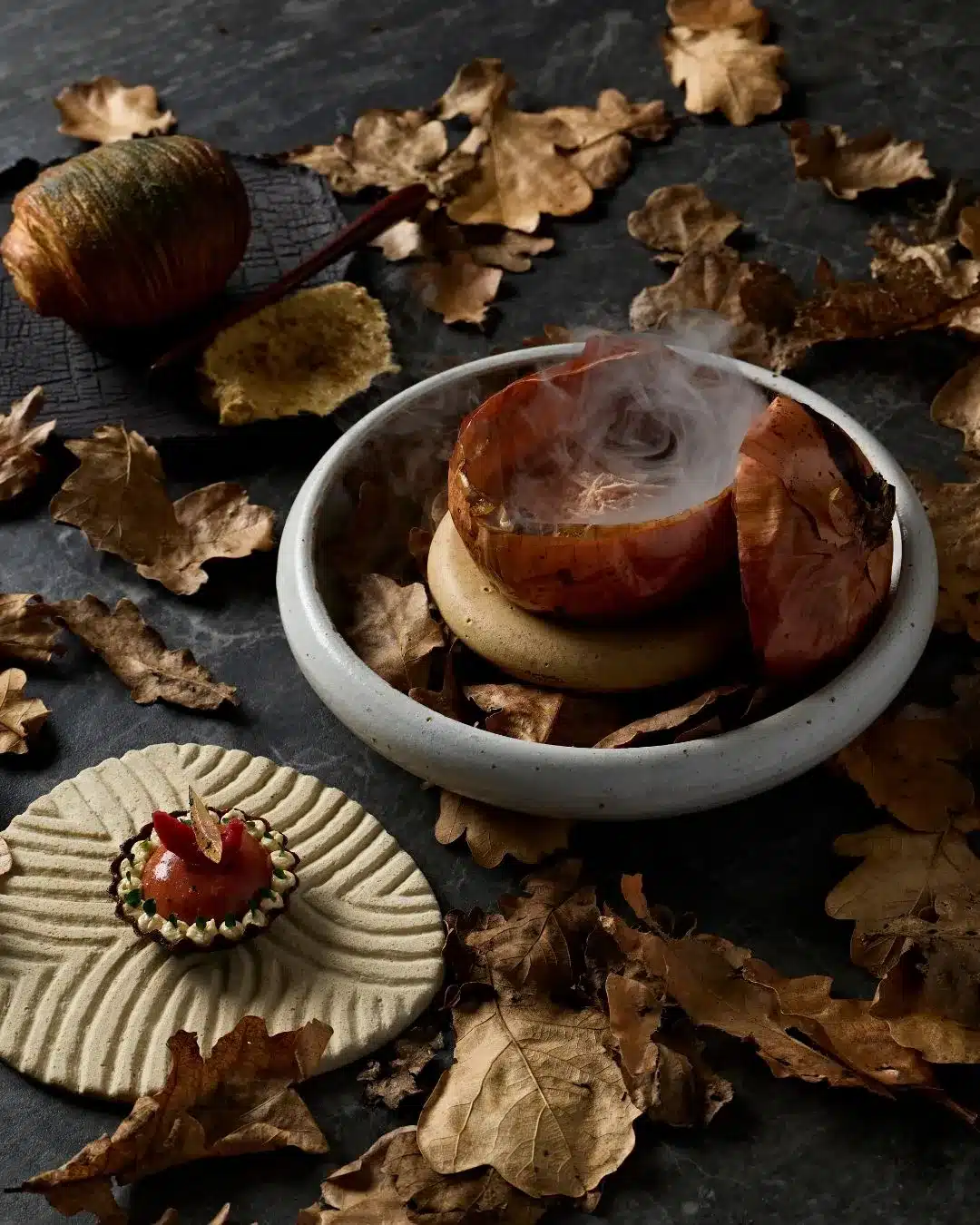 Hardy's Verandah - smoking dish served in a hollowed onion, styled with autumn leaves.