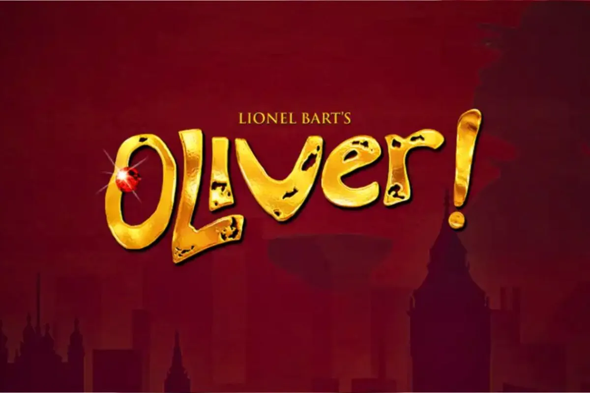 Gold text reading "Lionel Bart's Oliver!" with a jewelled ruby on the O, set against a dark red London skyline silhouette.