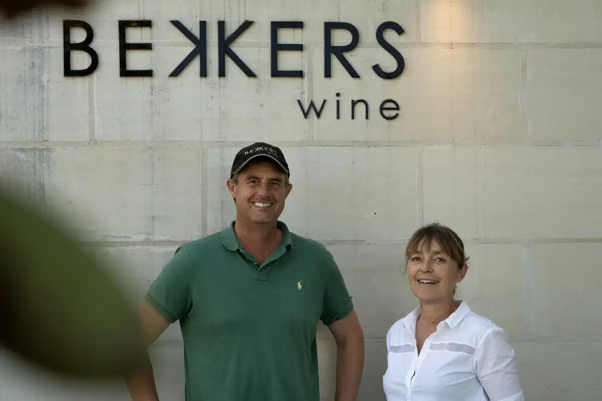 Bekkers Wines founders standing in front of the winery's signage in McLaren Vale.